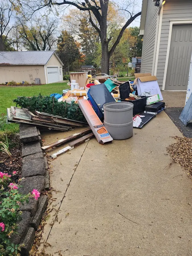 Dumpster being loaded with debris for Commercial Dumpster Rental in Taylor